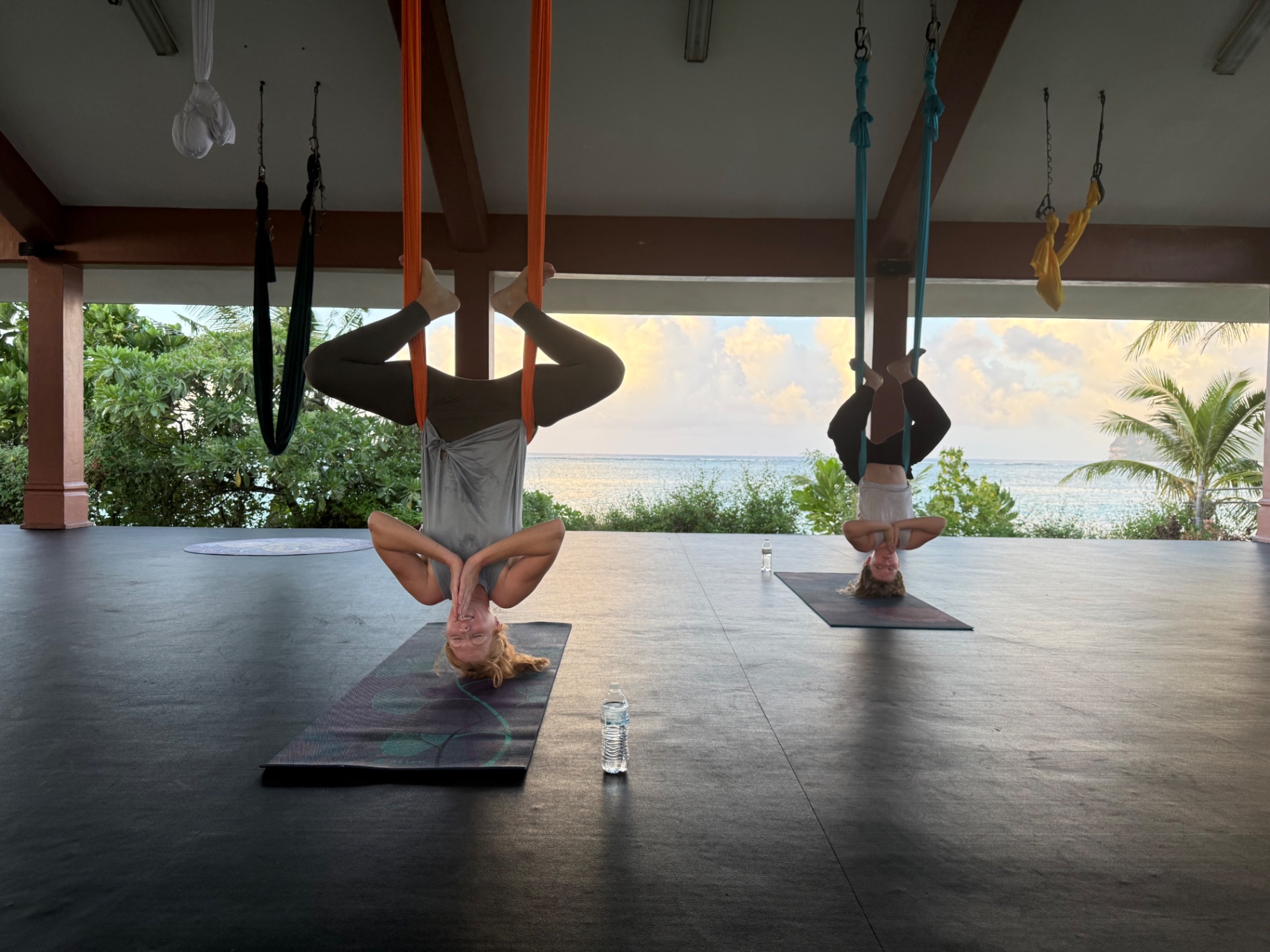 Sunset aerial yoga overlooking the ocean