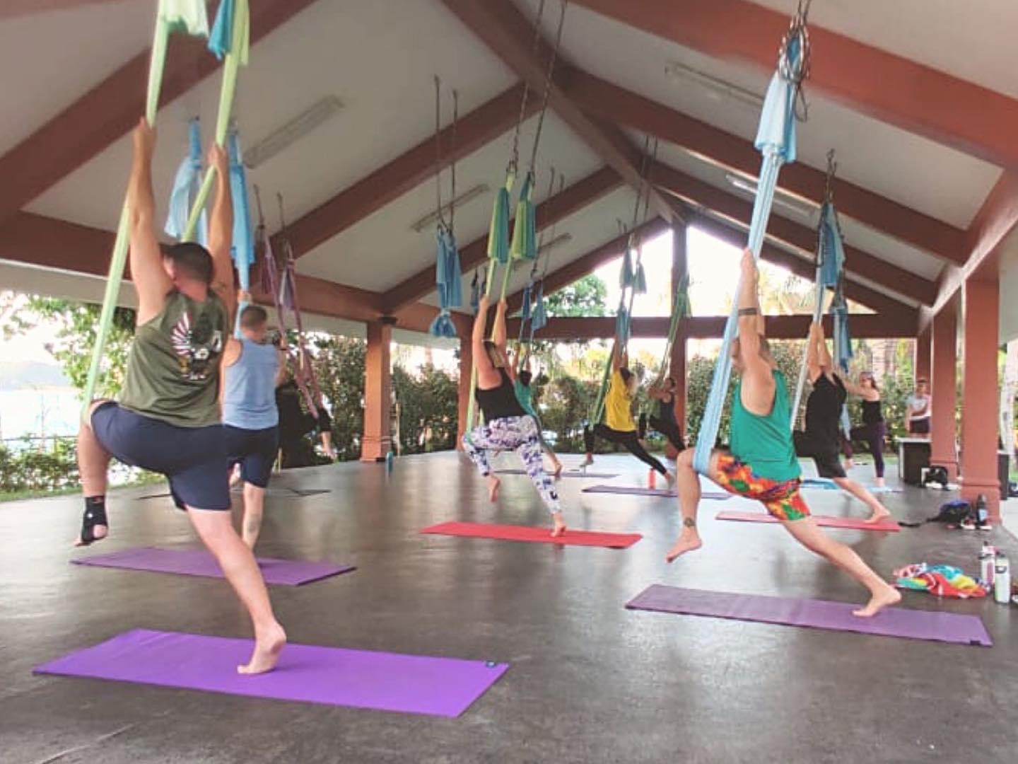 Warrior pose with aerial silks